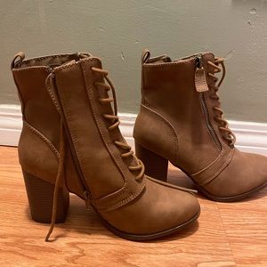 Brown boot heels with laces